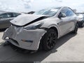 2023 Tesla Model Y — photo 2 of 24 | VIN 7SAYGAEE9PF784458
