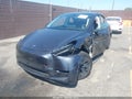 2024 Tesla Model Y — photo 2 of 20 | VIN 7SAYGDEE0RF176770