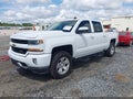 2018 Chevrolet Silverado 1500 — photo 2 of 16 | VIN 3GCUKREC5JG264900