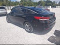 2016 Kia Optima — photo 3 of 16 | VIN 5XXGT4L35GG102339