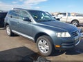 2004 Volkswagen Touareg — photo 1 of 16 | VIN WVGCM77L94D063084