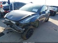 2023 Tesla Model Y — photo 2 of 22 | VIN 7SAYGDEE9PA053866