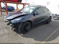 2022 Tesla Model Y — photo 2 of 20 | VIN 7SAYGDEFXNF490204