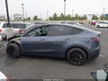 2023 Tesla Model Y — photo 14 of 18 | VIN 7SAYGAEE5PF778298