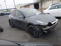 2023 Tesla Model Y — photo 1 of 18 | VIN 7SAYGAEE5PF778298