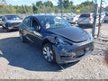 2024 Tesla Model Y — photo 1 of 18 | VIN 7SAYGDED3RF092143