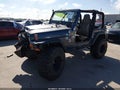 2004 Jeep Wrangler — photo 2 of 17 | VIN 1J4FA29164P700983