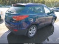 2011 Hyundai Tucson — photo 4 of 18 | VIN KM8JUCAC6BU225212