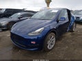 2023 Tesla Model Y — photo 2 of 16 | VIN 7SAYGDEE8PF949076