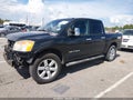 2012 Nissan Titan — photo 2 of 16 | VIN 1N6BA0EC8CN327260