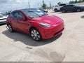 2023 Tesla Model Y — photo 1 of 18 | VIN 7SAYGDEE1PA170695