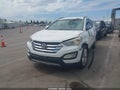2014 Hyundai Santa Fe — photo 2 of 13 | VIN 5XYZU3LA3EG150851