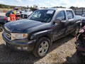 2011 Honda Ridgeline — photo 2 of 16 | VIN 5FPYK1F58BB453025