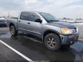 2015 Nissan Titan — photo 1 of 16 | VIN 1N6BA0EC9FN501762