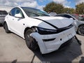 2026 Tesla Model Y — photo 1 of 22 | VIN 7SAYGDEE3TA609843