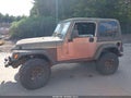 2004 Jeep Wrangler — photo 13 of 15 | VIN 1J4FA69S34P704988