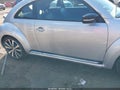 2012 Volkswagen Beetle — photo 11 of 13 | VIN 3VWVA7AT2CM660222
