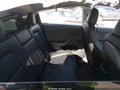 2023 Tesla Model Y — photo 8 of 18 | VIN 7SAYGDEE0PA152348