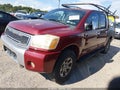 2004 Nissan Titan — photo 2 of 11 | VIN 1N6AA07B34N504234