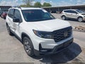 2023 Honda Passport — photo 1 of 17 | VIN 5FNYF8H67PB019570
