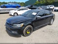 2016 Volkswagen Passat — photo 2 of 16 | VIN 1VWCM7A38GC006265