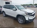2024 Honda Passport — photo 1 of 16 | VIN 5FNYF8H59RB003123