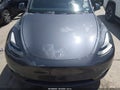2023 Tesla Model Y — photo 11 of 22 | VIN 7SAYGAEE9PF708433