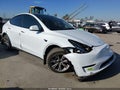 2023 Tesla Model Y — photo 1 of 18 | VIN 7SAYGDEE6PA030786