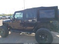 2009 Jeep Wrangler Unlimited — photo 14 of 16 | VIN 1J8GA59109L772037