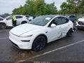2026 Tesla Model Y — photo 2 of 15 | VIN 7SAYGDEE7TA741794