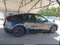 2025 Tesla Model Y — photo 12 of 15 | VIN 7SAYGDED3SF320633