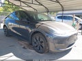 2025 Tesla Model Y — photo 1 of 15 | VIN 7SAYGDED3SF320633