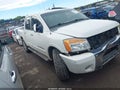 2009 Nissan Titan — photo 13 of 16 | VIN 1N6BA07D69N315672