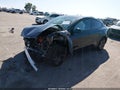2026 Tesla Model Y — photo 2 of 16 | VIN 7SAYGDEE2TF704350