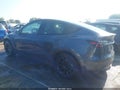 2023 Tesla Model Y — photo 13 of 18 | VIN 7SAYGAEE3PF659777
