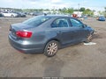 2014 Volkswagen Jetta — photo 4 of 10 | VIN 3VWD17AJ1EM286778