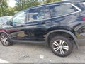 2018 Honda Pilot — photo 14 of 16 | VIN 5FNYF5H55JB014798