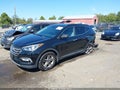 2017 Hyundai Santa Fe — photo 2 of 17 | VIN 5NMZUDLB1HH005171