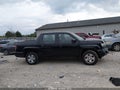 2012 Honda Ridgeline — photo 13 of 16 | VIN 5FPYK1F28CB458653