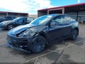 2026 Tesla Model Y — photo 2 of 19 | VIN 7SAYGDED4TF537500