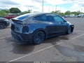 2026 Tesla Model Y — photo 4 of 19 | VIN 7SAYGDED4TF537500