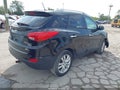 2012 Hyundai Tucson — photo 4 of 16 | VIN KM8JUCAC6CU381610