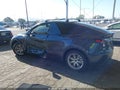 2024 Tesla Model Y — photo 13 of 15 | VIN 7SAYGDED8RF083339