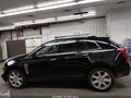 2016 Cadillac SRX — photo 14 of 16 | VIN 3GYFNCE31GS580632