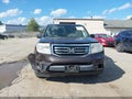 2014 Honda Pilot — photo 12 of 16 | VIN 5FNYF4H29EB037622