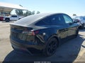 2022 Tesla Model Y — photo 4 of 19 | VIN 7SAYGAEE2NF377398