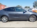 2023 Tesla Model Y — photo 13 of 16 | VIN 7SAYGDEE6PA167789