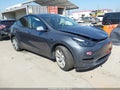 2023 Tesla Model Y — photo 1 of 16 | VIN 7SAYGDEE6PA167789