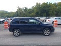 2014 Jeep Compass — photo 13 of 16 | VIN 1C4NJDBB7ED858512