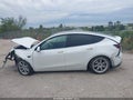 2023 Tesla Model Y — photo 13 of 15 | VIN 7SAYGAEE4PF762514